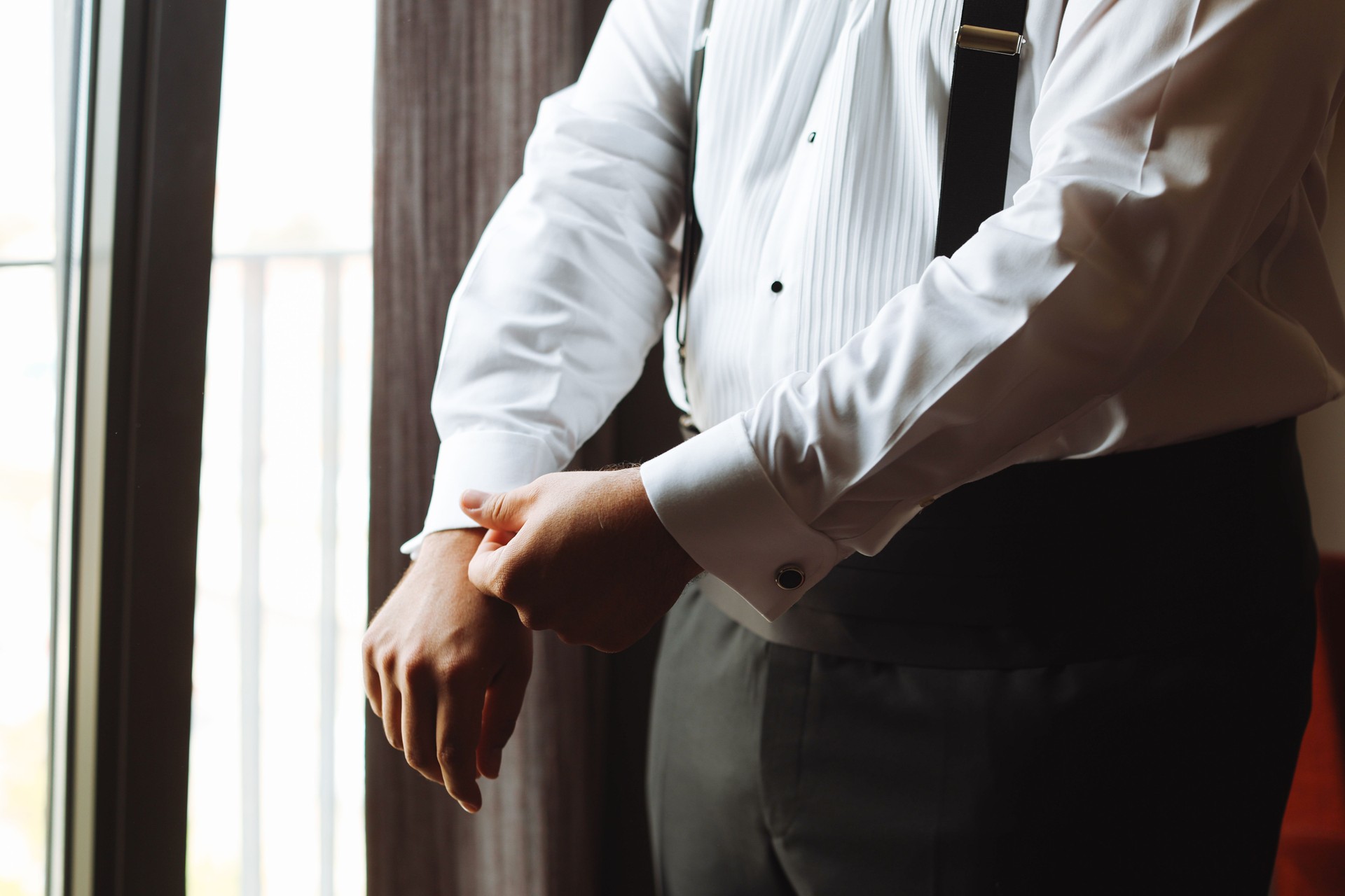 Groom wearing a boutonniere at his wedding