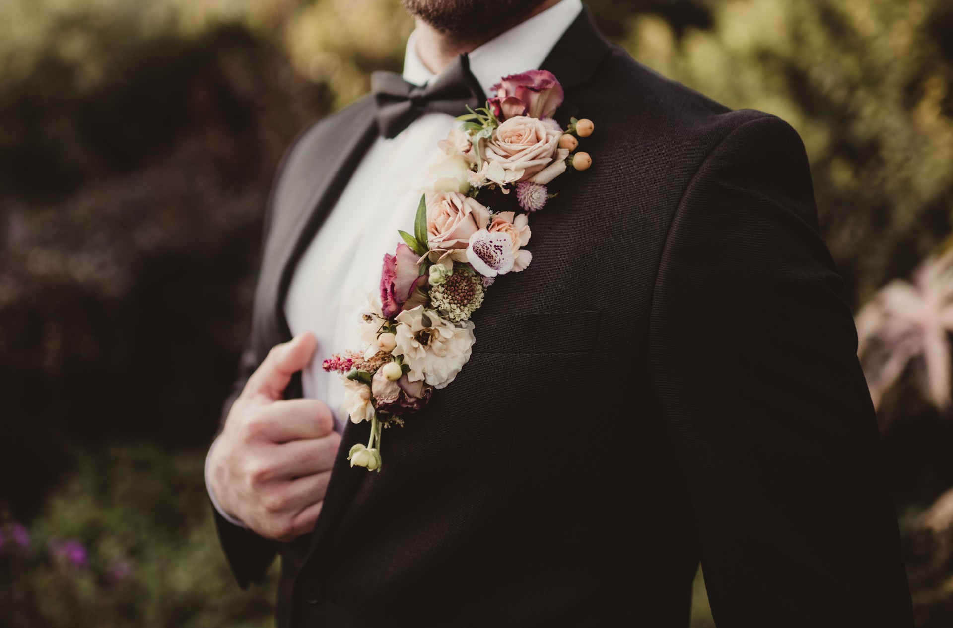 Floral  boutonniere on a groom's suit at a wedding